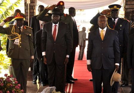 South Sudan's President Salva Kiir (C) and Uganda's President Yoweri Museveni (R) arrive at John Garang's Mausoleum to celebrate South Sudan's 4th Independence Day in the capital Juba, July 9, 2015. PHOTO BY REUTERS/Jok Solomoun