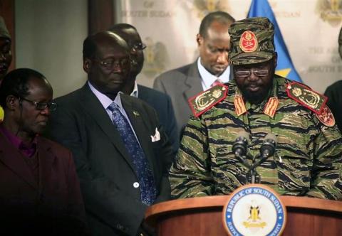 South Sudan's President Salva Kiir (R) addresses a news conference at the Presidential Palace in capital Juba