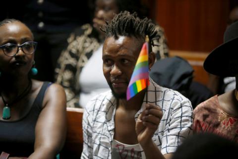 An LGBT activist holds the rainbow flag during a court hearing in the Milimani high Court in Nairobi in Nairobi, Kenya, February 22, 2019. PHOTO BY REUTERS/Baz Ratner