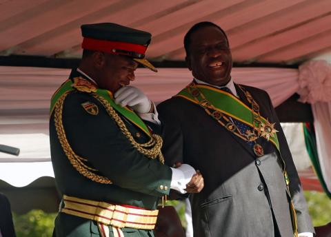 Zimbabwe's President Emmerson Mnangagwa (R) shares a joke with Vice President General Constatino Chiwenga. PHOTO BY REUTERS/Philimon Bulawayo