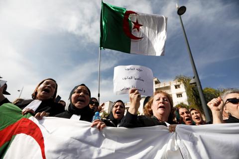 Lawyers hold banners as they chant slogans during a protest to denounce an offer by President Abdelaziz Bouteflika to run in elections next month but not to serve a full term if re-elected, in Algiers, Algeria, March 7, 2019. PHOTO BY REUTERS/Zohra Bensemra