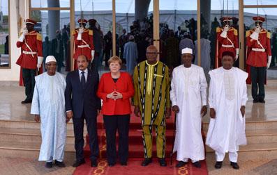 German Chancellor Angela Merkel poses for a group photo as she attends a meeting of West African leaders of the G5 Sahel, a regional force made up of soldiers from Mali, Niger, Burkina Faso, Chad and Mauritania to combat Islamist extremists in Ouagadougou, Burkina Faso, May 1, 2019. PHOTO BY REUTERS/Anne Mimault