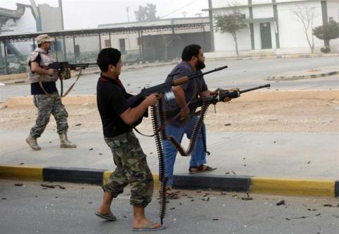 Libyan militias shoot at a building in center of Bani Walid