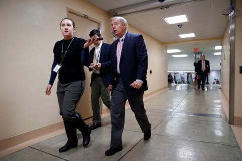 Sen. Lindsey Graham (R-SC) speaks with reporters as he arrives for meeting about the Republican Tax Reform package on Capitol Hill in Washington, U.S., November 9, 2017. PHOTO BY REUTERS/Aaron P. Bernstein