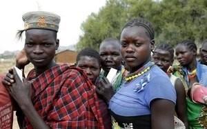 People from Karamojong tribe wait in line to vote at a polling station during the presidential elections in a village near town of Kaabong in Karamoja region, Uganda, February 18, 2016. PHOTO BY REUTERS/Goran Tomasevic