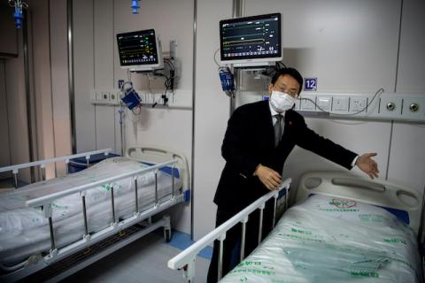 Doctor Hangzhou Lu, co-director of Shanghai Public Clinical Center Shanghai, shows a quarantine room for coronavirus patients at finished but still unused building A2, in Shanghai, China, February 17, 2020. PHOTO BY REUTERS/Noel Celis/Pool