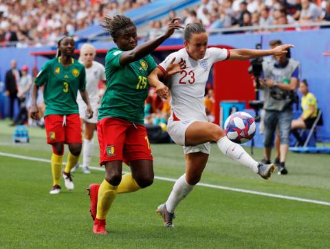 England's Lucy Staniforth in action with Cameroon's Ysis Sinking. PHOTO BY REUTERS/Phil Noble