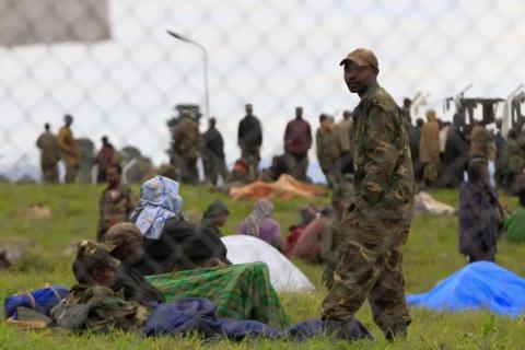 Congolese M23 rebels rest inside an enclosure after surrendering to Uganda's government at Rugwerero village in Kisoro district, 489km (293 miles) west from Uganda capital Kampala, November 8, 2013. PHOTO BY REUTERS/James Akena