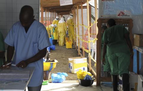 Medicins Sans Frontieres (MSF) health workers prepare at ELWA's hospital isolation camp during the visit of Senior United Nations (U.N.) System Coordinator for Ebola, David Nabarro, in Monrovia