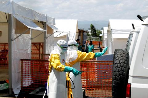 Health workers dressed in protective suits disinfect an ambulance transporting a suspected Ebola patient to the newly constructed MSF(Doctors Without Borders) Ebola treatment centre in Goma, Democratic Republic of Congo, August 4, 2019. PHOTO BY REUTERS/Baz Ratner