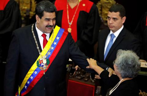 Venezuela's President Nicolas Maduro reacts with National Electoral Council (CNE) President Tibisay Lucena during a ceremony to mark the opening of the judicial year at the Supreme Court of Justice (TSJ), in Caracas, Venezuela, January 24, 2019. PHOTO BY REUTERS/Carlos Garcia Rawlins