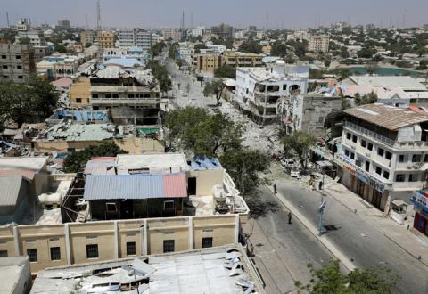 Security personnel are seen next to buildings damaged at the scene where a suicide car bomb exploded targeting a Mogadishu hotel in a business center in Maka Al Mukaram street in Mogadishu, Somalia, March 1, 2019. PHOTO BY REUTERS/Feisal Omar