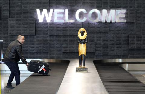 A man takes his luggage after arriving at the new Sphinx International Airport in west Cairo, Egypt, January 26, 2019. PHOTO BY REUTERS/Mohamed Abd El Ghany