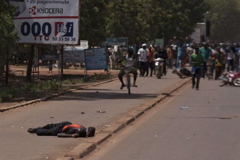 A man lies injured from bullet wounds fired by Burkinabe soldiers in Ouagadougou, capital of Burkina Faso, October 30, 2014. PHOTO BY REUTERS/Joe Penney