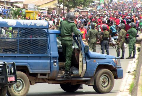 Members of security forces stand guard as people march during a protest over a suspected effort by President Alpha Conde to seek a third term in Conakry, Guinea, October 24, 2019. PHOTO BY REUTERS/Saliou Samb