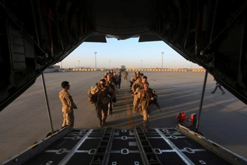 U.S. Marines prepare to board a plane at the end of operations for U.S. Marines and British combat troops in Helmand, October 26, 2014. PHOTO BY REUTERS/Omar Sobhani
