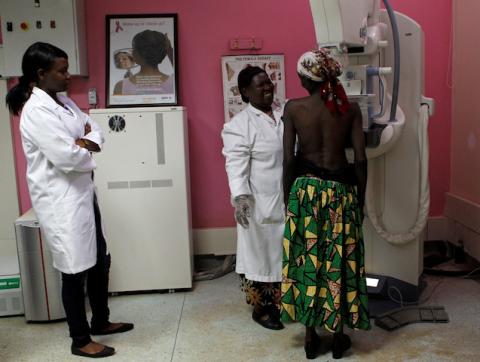 Medical workers prepare a patient to undergo a mammogram X-ray picture of the breast to look for early signs of breast cancer in the radiology unit at the Kenyatta National Hospital in Nairobi, Kenya, January 22, 2020. PHOTO BY REUTERS/Njeri Mwangi