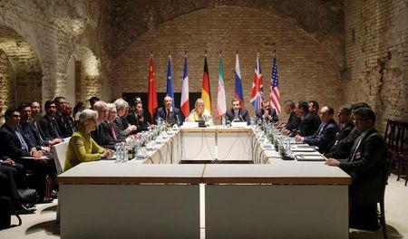 Negotiators of Iran and six world powers face each other at a table in the historic basement of Palais Coburg hotel in Vienna, April 24, 2015. PHOTO BY REUTERS/Heinz-Peter Bader