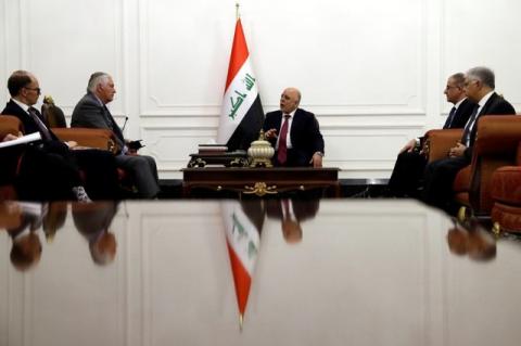 U.S. Secretary of State Rex Tillerson (2-L) listens as Iraqi Prime Minister Haider al-Abadi (C) speaks during their meeting in Baghdad, Iraq, October 23, 2017. PHOTO BY REUTERS/Alex Brandon