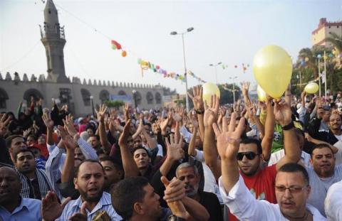 Members of the Muslim Brotherhood and supporters of ousted Egyptian President Mohamed Mursi shout slogans