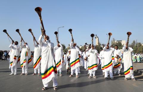 Men blow traditional trumpets during the 123rd anniversary celebration of the battle of Adwa where the Ethiopian forces defeated an invading Italian forces, in Addis Ababa, Ethiopia, March 2, 2019. PHOTO BY REUTERS/Tiksa Negeri