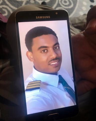 Menur Mohamed, brother to Ethiopian Airlines ET 302 First Officer Ahmednur Mohamed, holds his phone with a photograph of his brother during a Reuters interview in Addis Ababa, March 17, 2019. PHOTO BY REUTERS/Maggie Fick