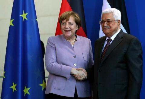 German Chancellor Angela Merkel and Palestinian President Mahmoud Abbas shake hands after a statement in Berlin, Germany, March 24, 2017. PHOTO BY REUTERS/Pawel Kopczynski