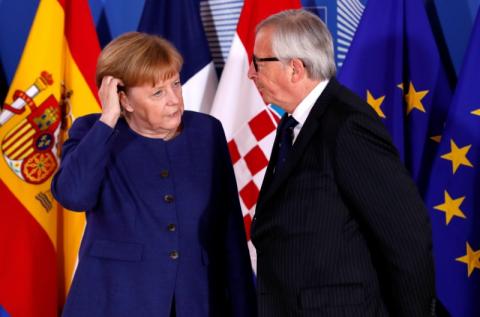 German Chancellor Angela Merkel is welcomed by European Commission President Jean-Claude Juncker at the start of an emergency European Union leaders summit on immigration at the EU Commission headquarters in Brussels, Belgium, June 24, 2018. PHOTO BY REUTERS/Yves Herman