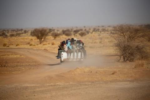 Migrants crossing the Sahara desert into Libya ride on the back of a pickup truck outside Agadez, Niger, May 9, 2016. PHOTO BY REUTERS/Joe Penney