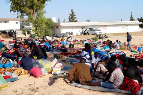 Migrants are seen with their belongings in the yard of a detention centre for mainly African migrants, hit by an air strike, in the Tajoura suburb of Tripoli, Libya, July 3, 2019. PHOTO BY REUTERS/Ismail Zitouny