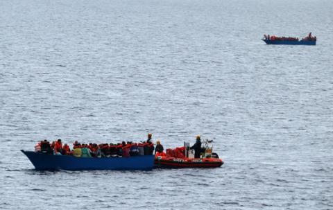 Migrants on a wooden boat are rescued by German NGO Jugend Rettet ship "Juventa" crew in the Mediterranean sea off Libya coast, June 18, 2017. PHOTO BY REUTERS/Stefano Rellandini