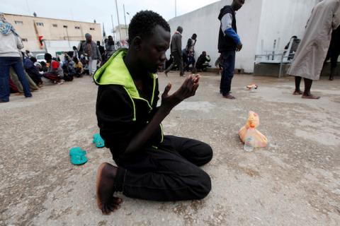 An illegal African migrant prays at a detention camp in Tripoli, Libya, March 22, 2017. PHOTO BY REUTERS/Ismail Zitouny