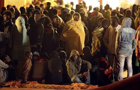 Migrants rest after disembark from tug boat Asso29 in the Sicilian harbour of Pozzallo, southern Italy, May 4, 2015. PHOTO BY REUTERS/Antonio Parrinello