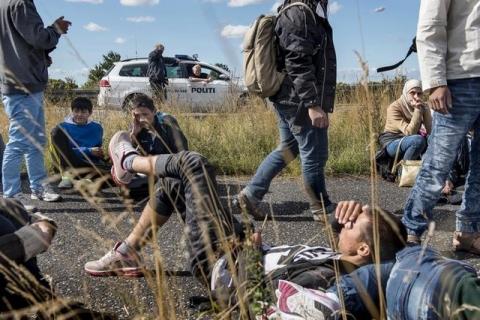 A large group of migrants, mainly from Syria, walk on a highway towards the north, September 7, 2015. PHOTO BY REUTERS/Bax Lindhardt