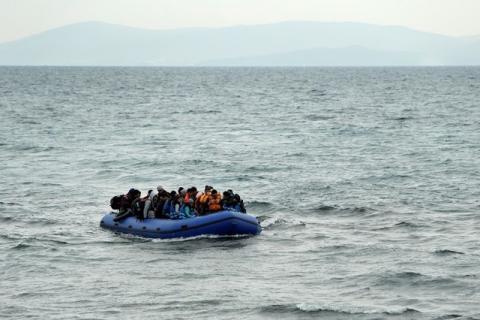 Refugees and migrants on a raft approach the shores of the Greek island of Lesbos, January 29, 2016. PHOTO BY REUTERS/Darrin Zammit Lupi