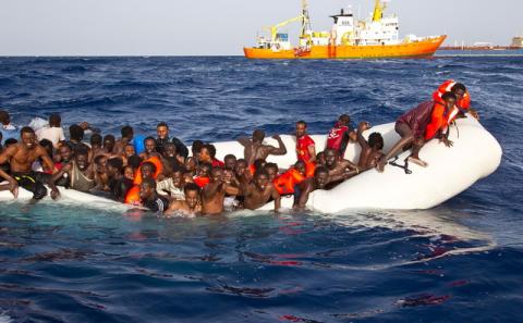 Migrants sit in a rubber dinghy during a rescue operation by SOS Mediterranee ship Aquarius off the coast of the Italian island of Lampedusa, 18, 2016. PHOTO BY REUTERS/SOS Mediterranee