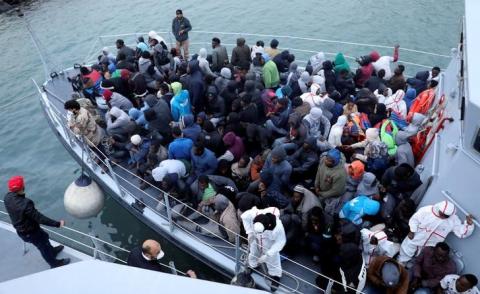 Migrants in a boat arrive at a naval base after they were rescued by Libyan coast guards, in Tripoli, Libya, January 9, 2018. PHOTO BY REUTERS/Hani Amara