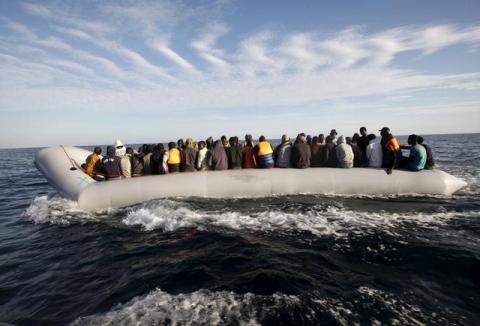 Migrants, who tried to flee to Europe, travel in a dinghy after they were stopped by Libyan coast guards and made to head to Tripoli, September 29, 2015. PHOTO BY REUTERS/Ismail Zitouny