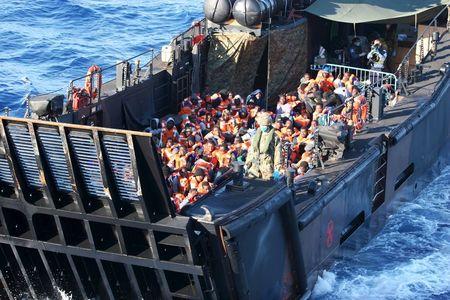 Migrants travel by landing craft before embarking on HMS Bulwark after being rescued from the Mediterranean between Italy and North Africa, May 13, 2015. PHOTO BY REUTERS/Jamie Weller