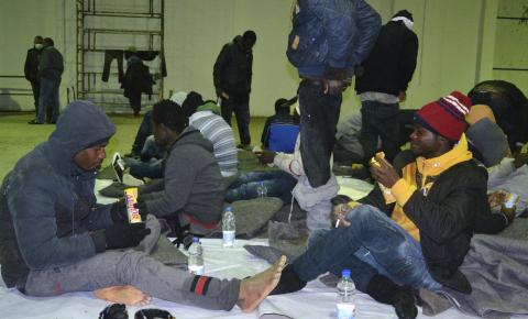 A group of would-be immigrants from various African countries, whom authorities said were found off the coast of Djerba after water seeped into their boat, rest at the port in Zarzis March 4, 2015. PHOTO BY REUTERS/Stringer