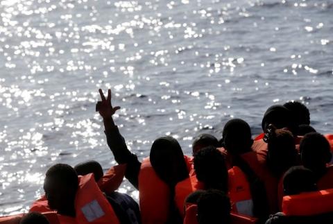 Migrants are seen during rescue operation in the Mediterranean Sea, October 20, 2016. PHOTO BY REUTERS/Yara Nardi/Italian Red Cross press office