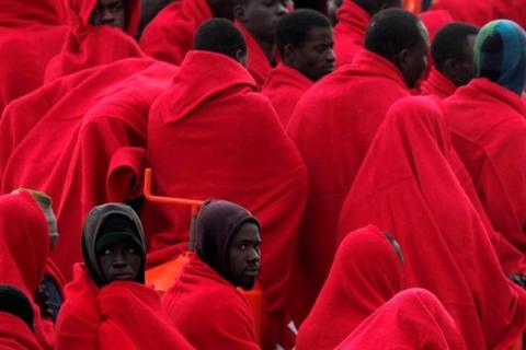 Migrants, who were part of a group intercepted aboard a dinghy off the coast in the Mediterranean sea, wrapped in blankets on a rescue boat upon arriving at a port in Malaga, southern Spain, December 3, 2016. PHOTO BY REUTERS/Jon Nazca