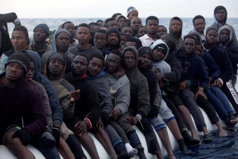 Sub-saharan migrants are seen aboard an overcrowded raft during a rescue operation by the Spanish NGO Proactiva Open Arms in the central Mediterranean Sea, 21 miles north of the coastal Libyan city of Sabratha, February 3, 2017. PHOTO BY REUTERS/Giorgos Moutafis