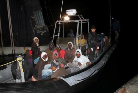 Migrants are seen on a boat after they were arrested by Libyan coastguards, in Tripoli, February 5, 2017. PHOTO BY REUTERS/Hani Amara