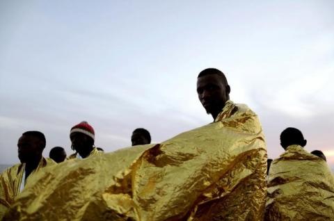 Migrants are seen onboard the rescue vessel Responder, a rescue boat run by the Malta-based NGO Migrant Offshore Aid Station (MOAS) and the Italian Red Cross (CRI), before arriving in the Italian harbour of Vibo Marina, Italy, October 22, 2016. PHOTO BY REUTERS/Yara Nardi/Italian Red Cross press office