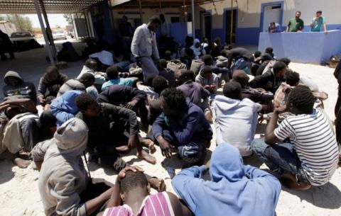 Illegal migrants sit at Gasr Garabulli port after they were rescued by Libyan Coast Guard, east of Tripoli, Libya, May 18, 2017. PHOTO BY REUTERS/Ismail Zitouny