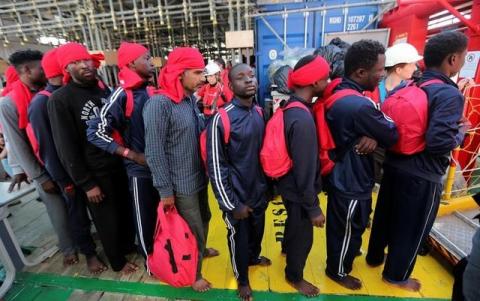 Migrants waits to disembark from the Vos Hestia ship as they arrives in the Crotone harbour, Italy, after being rescued by " Save the Children" crew in the Mediterranean sea off the Libya coast, June 21, 2017. PHOTO BY REUTERS/Stefano Rellandini