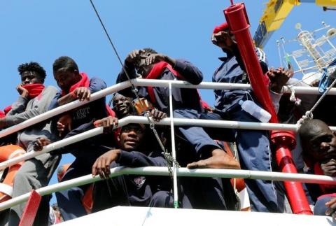 Migrants waits to disembark from the Vos Hestia ship as they arrives in the Crotone harbour, Italy, after being rescued by " Save the Children" crew in the Mediterranean sea off the Libya coast, June 21, 2017. PHOTO BY REUTERS/Stefano Rellandini