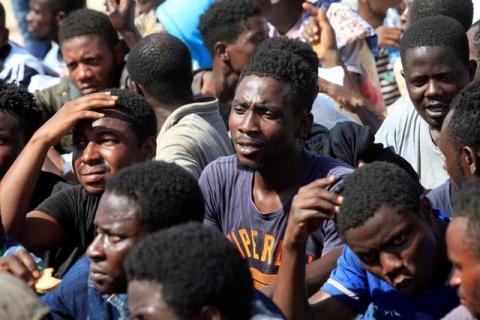 Migrants react after they were rescued by Libyan coastguard, at a naval post in the coastal city of Tripoli, Libya, July 13, 2017. PHOTO BY REUTERS/Ismail Zitouny