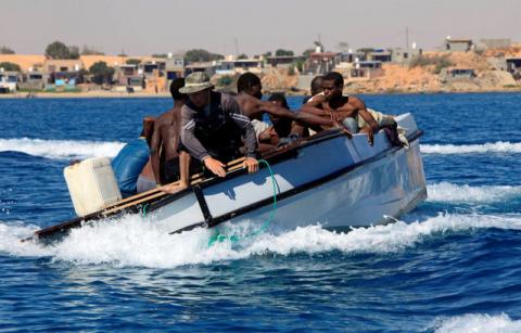 Migrants ride in a boat after they were rescued by Libyan coastguard off the coast of Gharaboli, east of Tripoli, Libya, July 8, 2017. PHOTO BY REUTERS/Ismail Zitouny